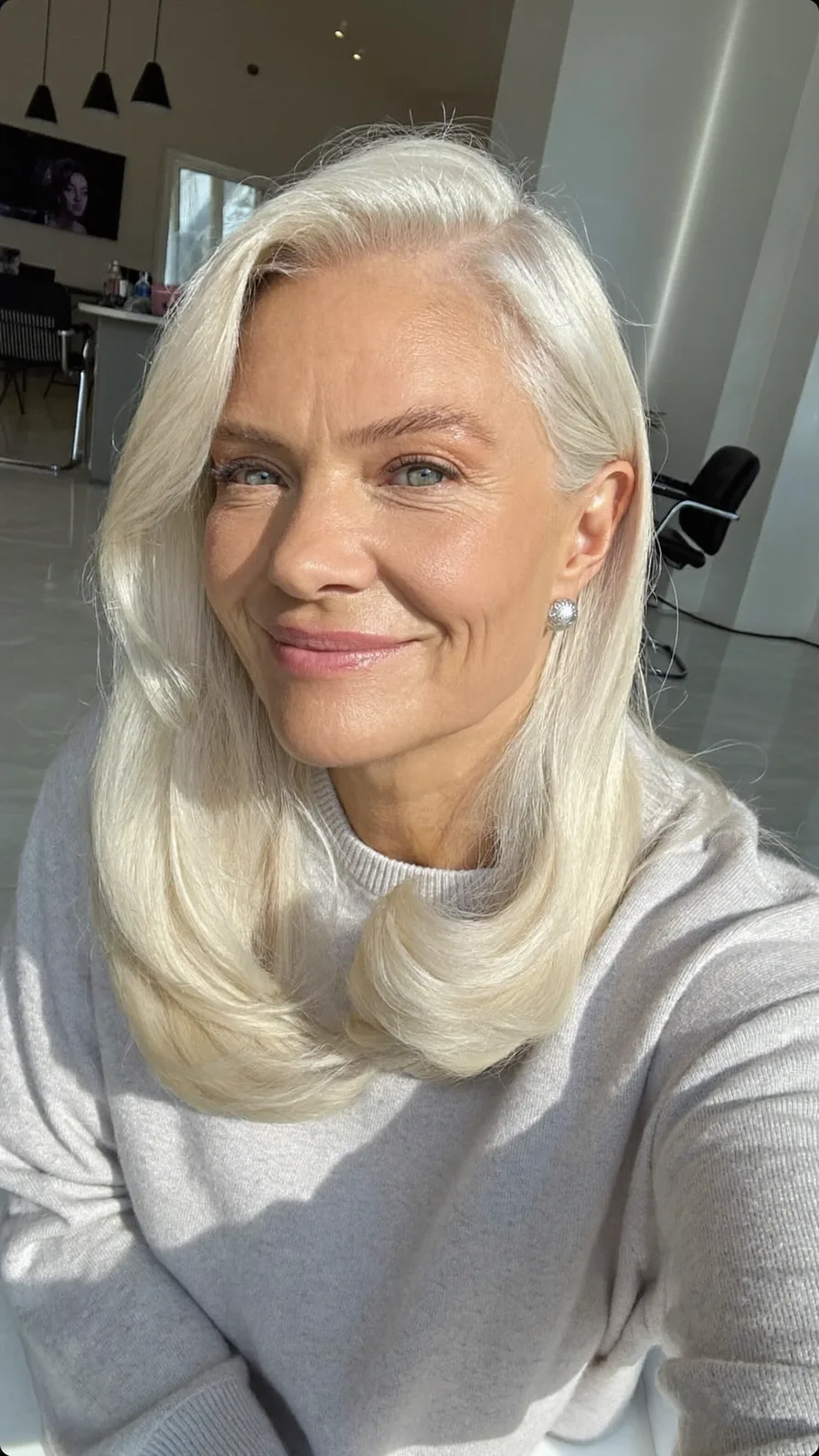 Elegant Platinum Medium Length Hair with Long Layers