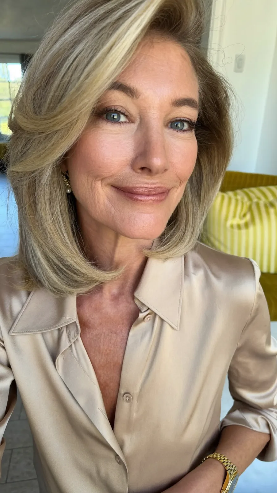 Voluminous Shoulder-Length Layered Ash Blonde Blowout Hairstyle