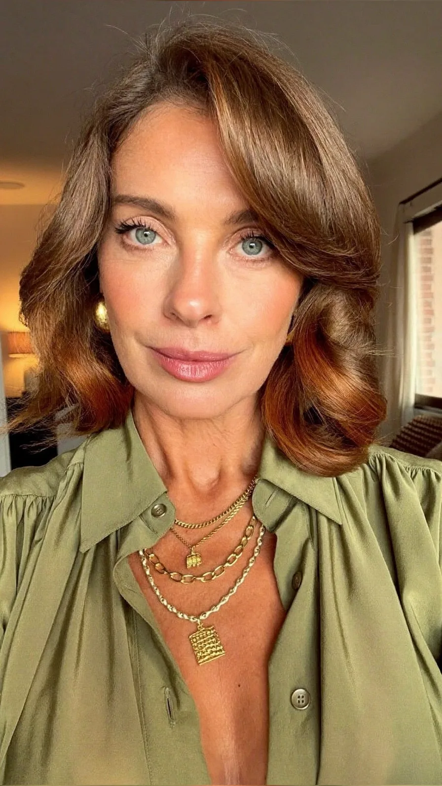 Voluminous Feathered Shoulder-Length Hair with Side-Swept Bangs