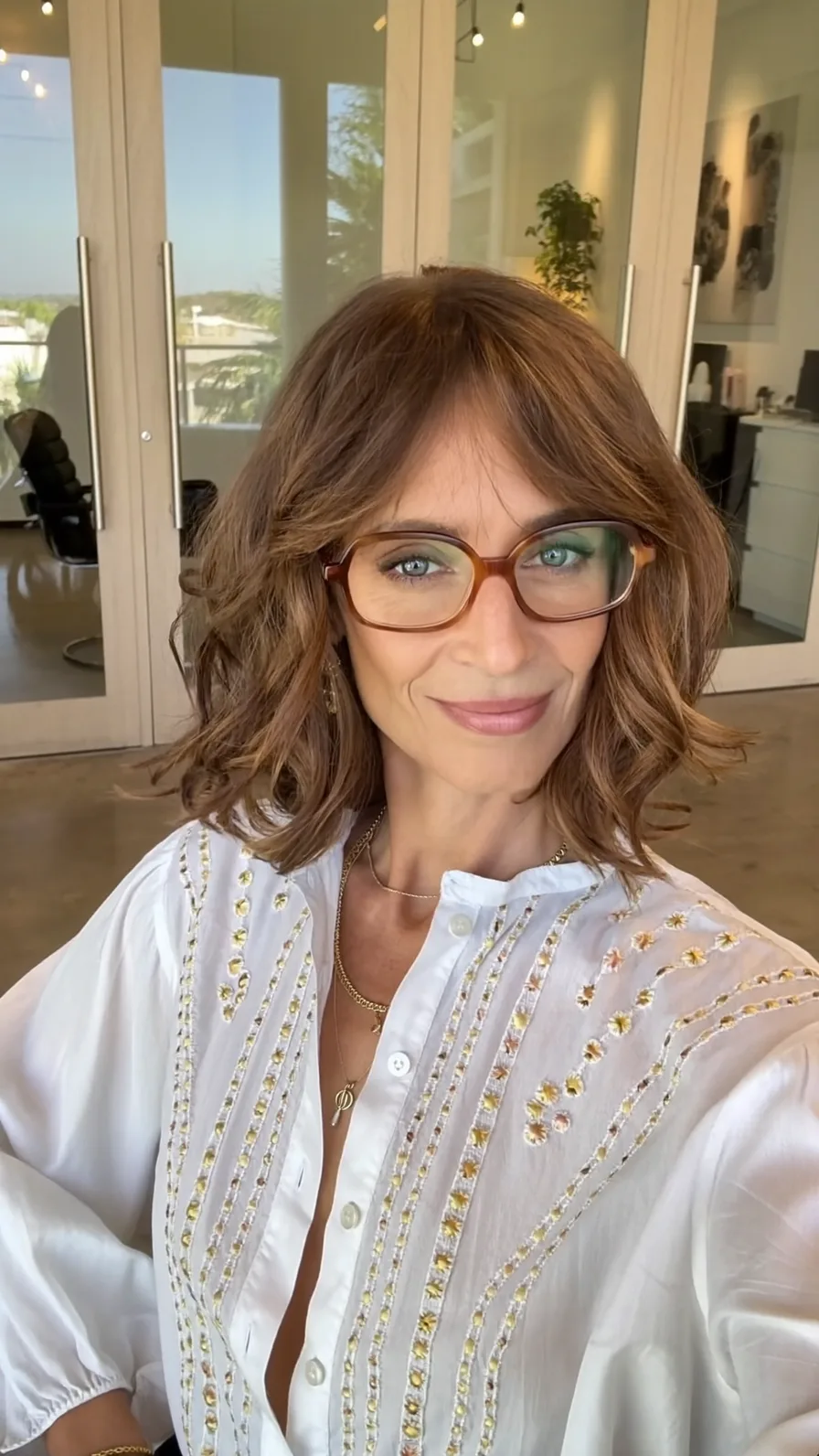 Soft Wavy Lob with Center-Parted Curtain Bangs and Caramel Highlights
