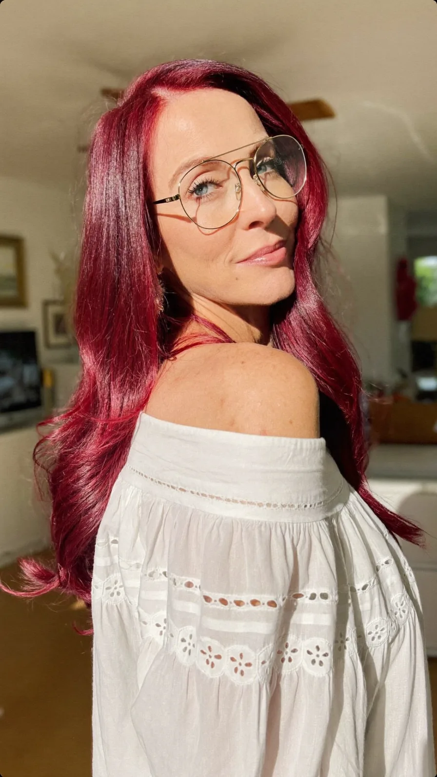 Vibrant Deep Magenta Long Layered Wavy Hairstyle with Side Part