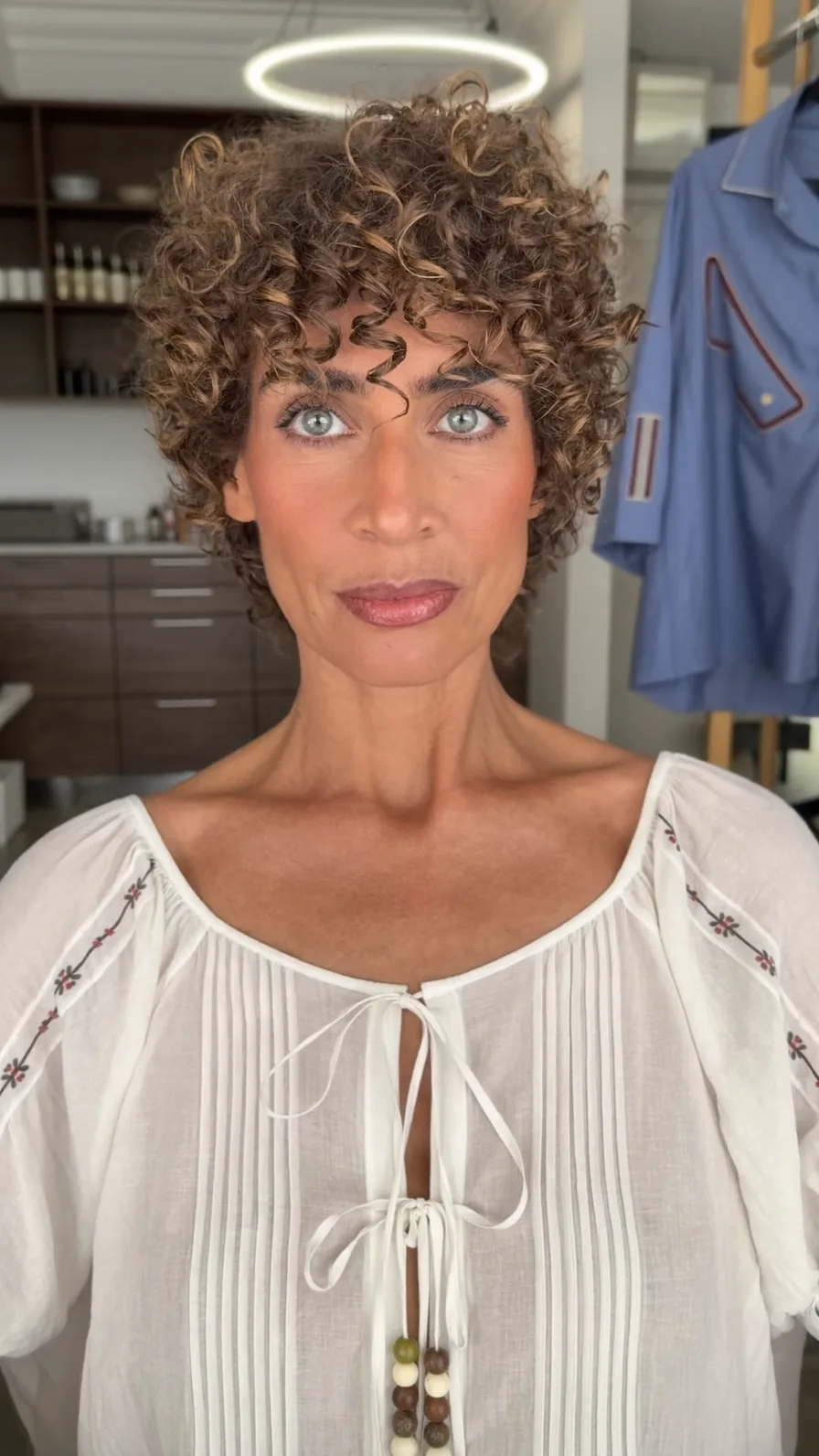 Voluminous Curly Pixie Cut with Layered Curtain Bangs