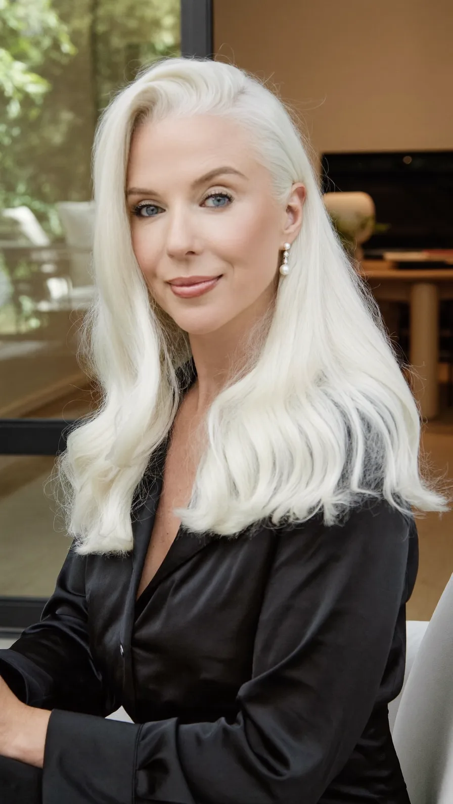 Elegant Platinum Blonde Medium Length Flowing Waves Hairstyle