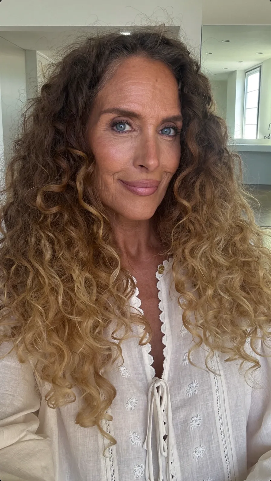Voluminous Curly Long Layers with Honey Blonde Balayage