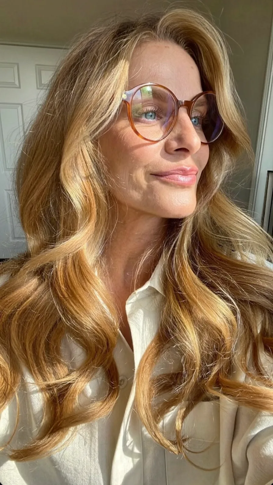 Voluminous Honey Blonde Long Layered Waves with Curtain Bangs