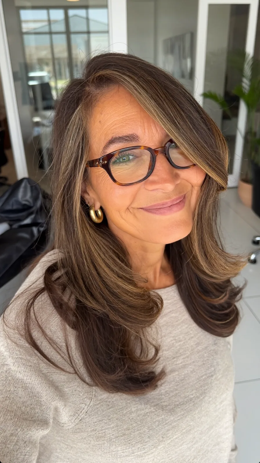 Elegant Long Layers with Side-Swept Highlights and Flicked Ends