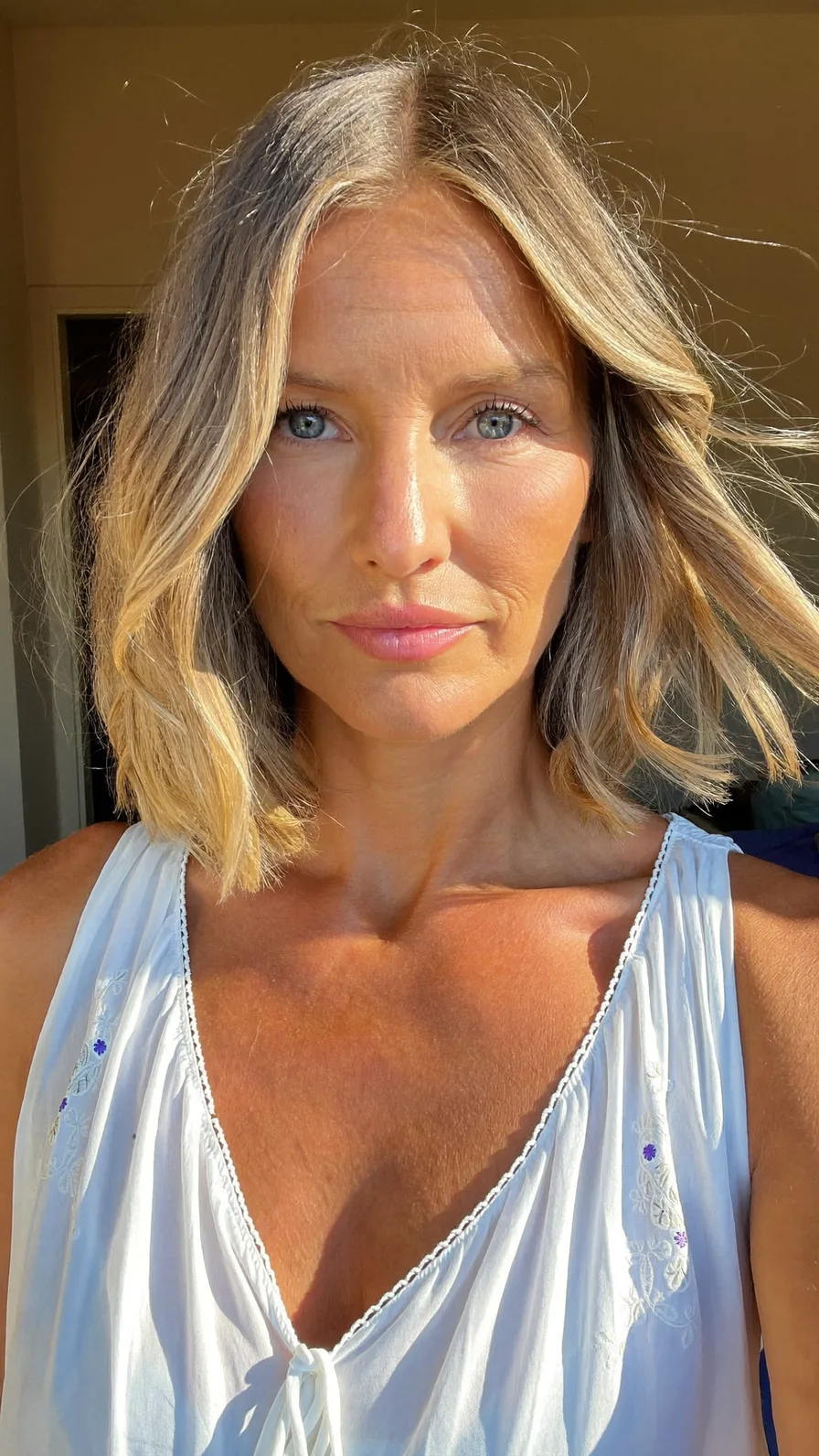 Modern Ash Blonde Shoulder-Length Lob with Soft Curtain Bangs