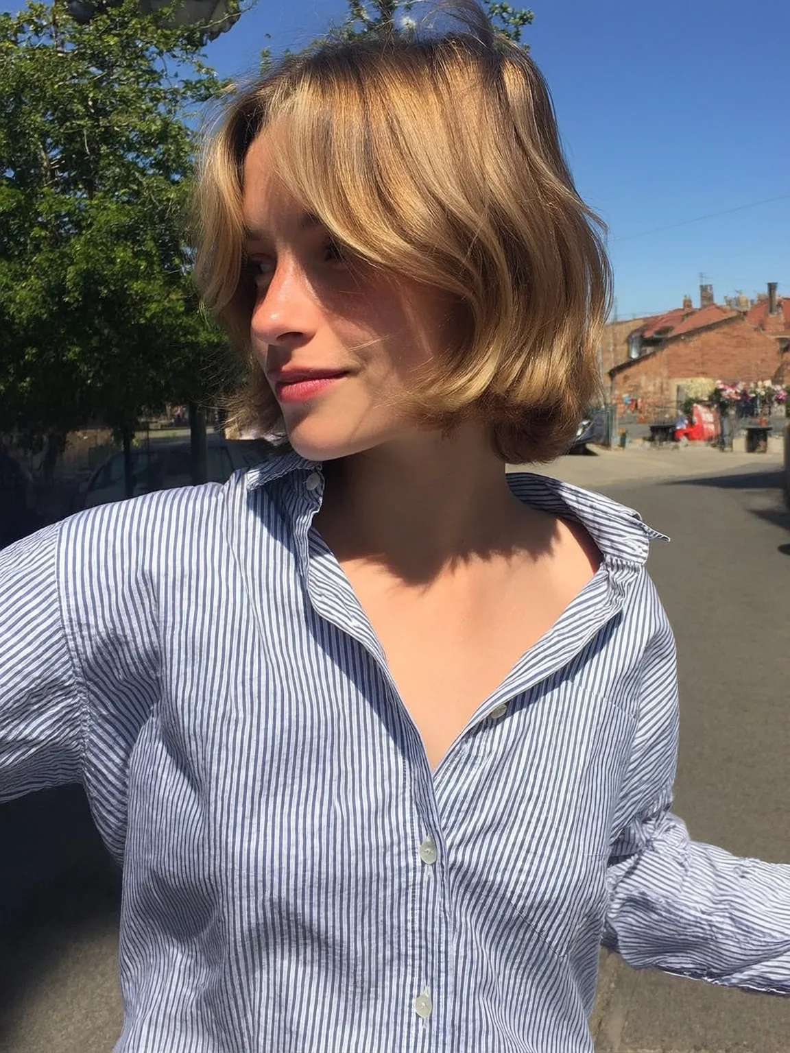 Chin-Length Bob with Curtain Bangs in Honey Blonde
