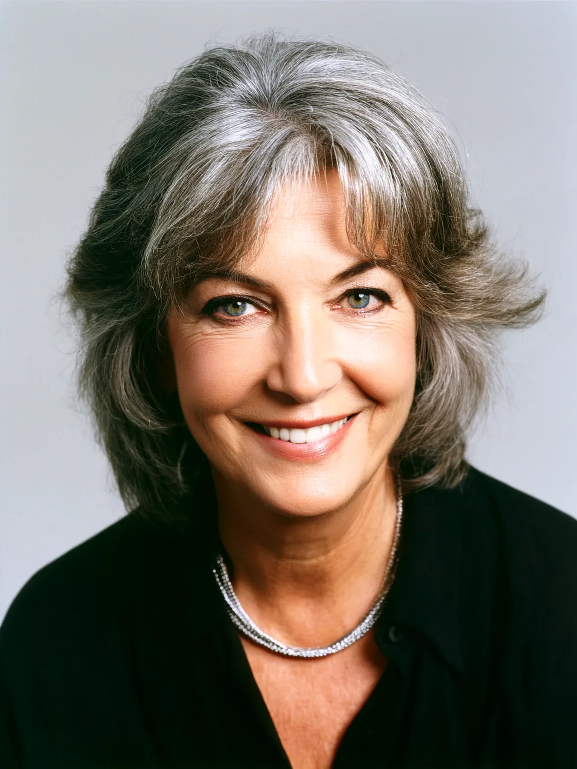 Shoulder-Length Layered Cut in Silver Frost with Long Bangs