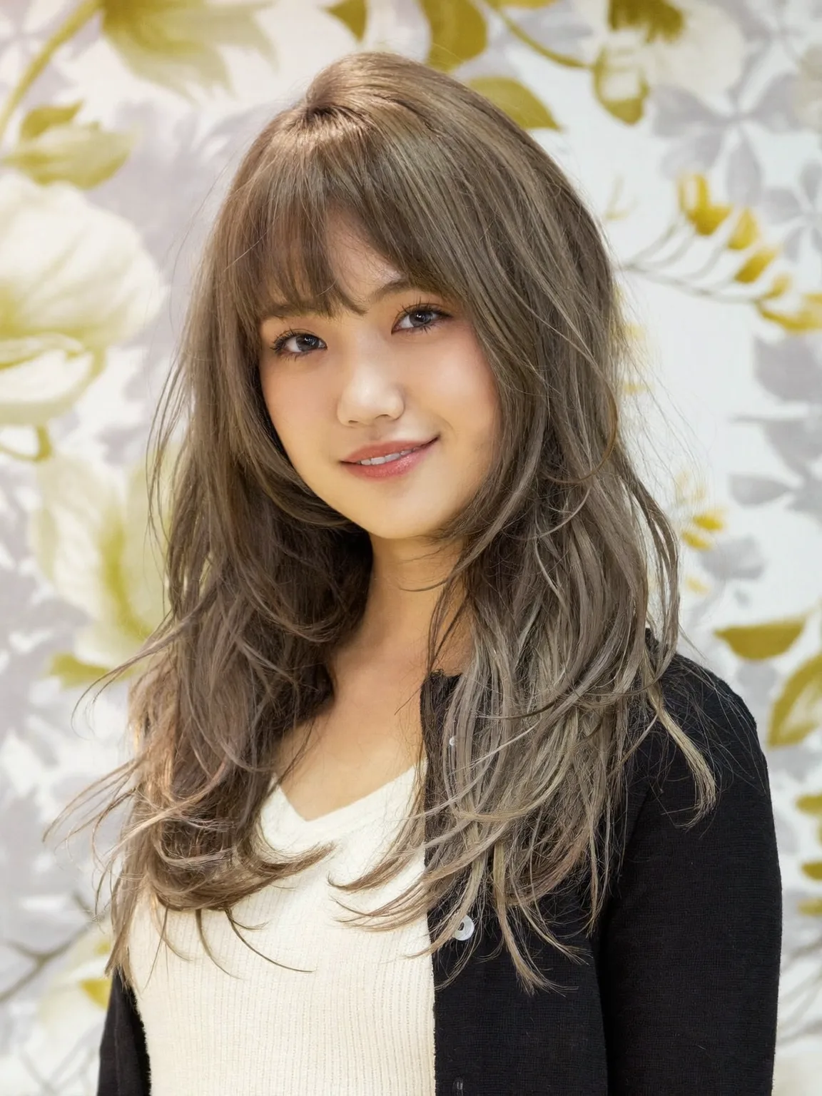 Long Wavy Ash Bronde Layers with Wispy Bangs