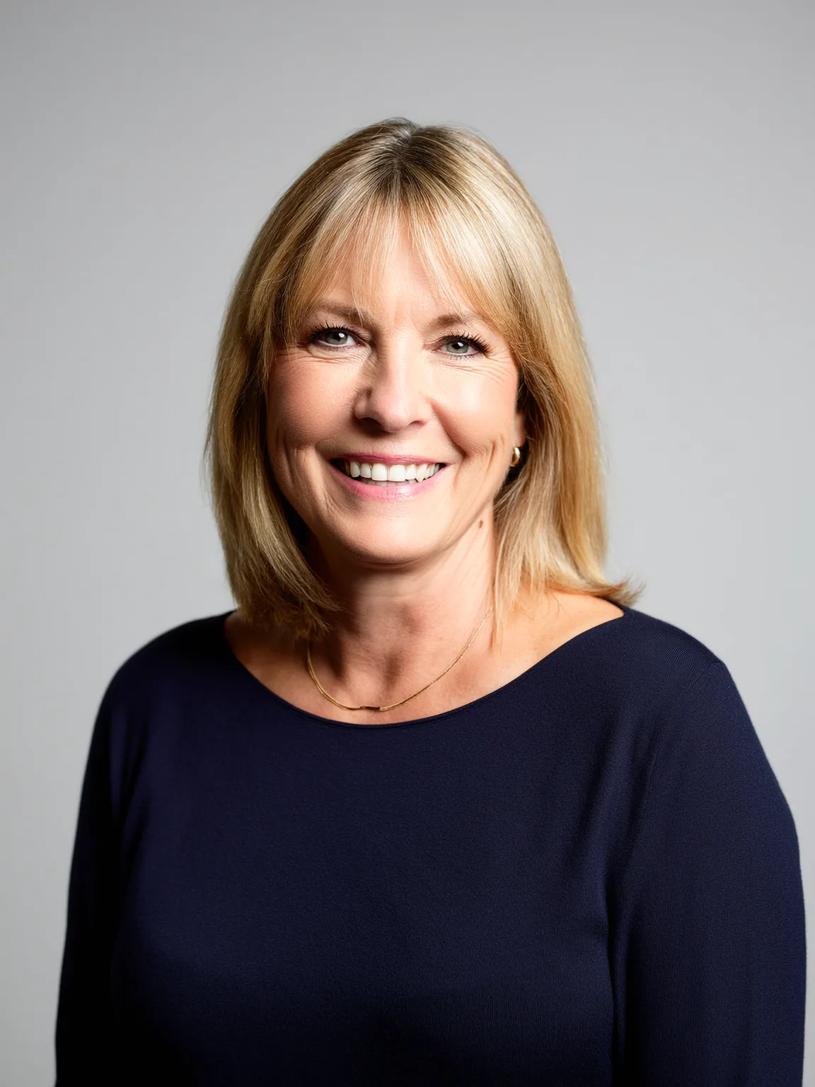Shoulder-Length Straight Honey Blonde Bob with Side Bangs