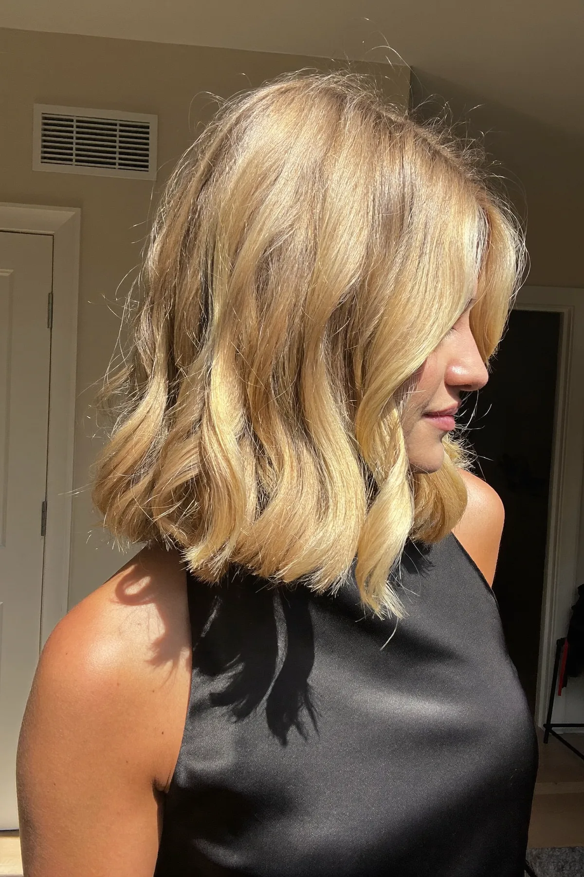 Honey Golden Blonde Wavy Bob with Curtain Bangs and Balayage