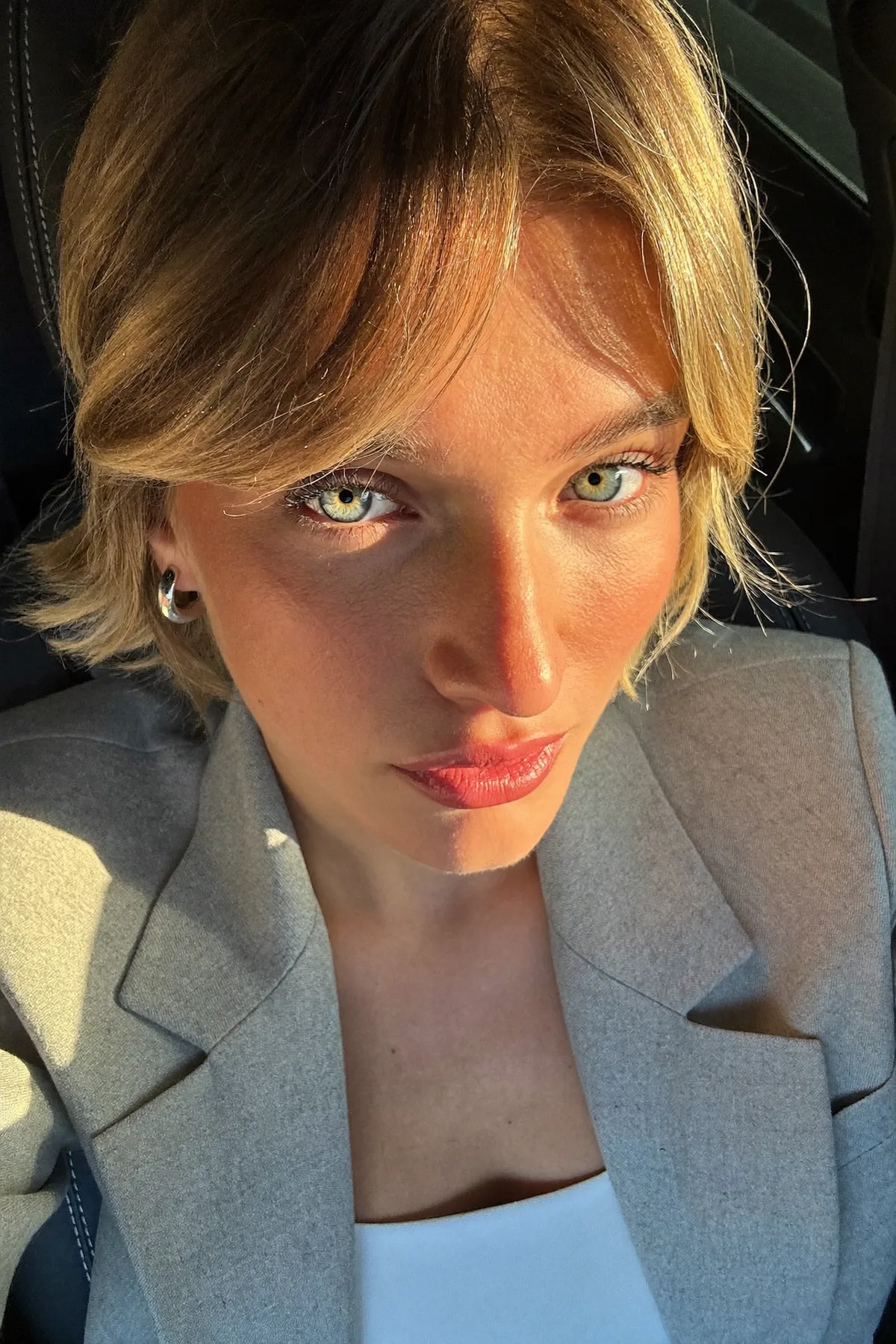 Sleek Honey Golden Blonde Chin-Length Bob with Curtain Bangs