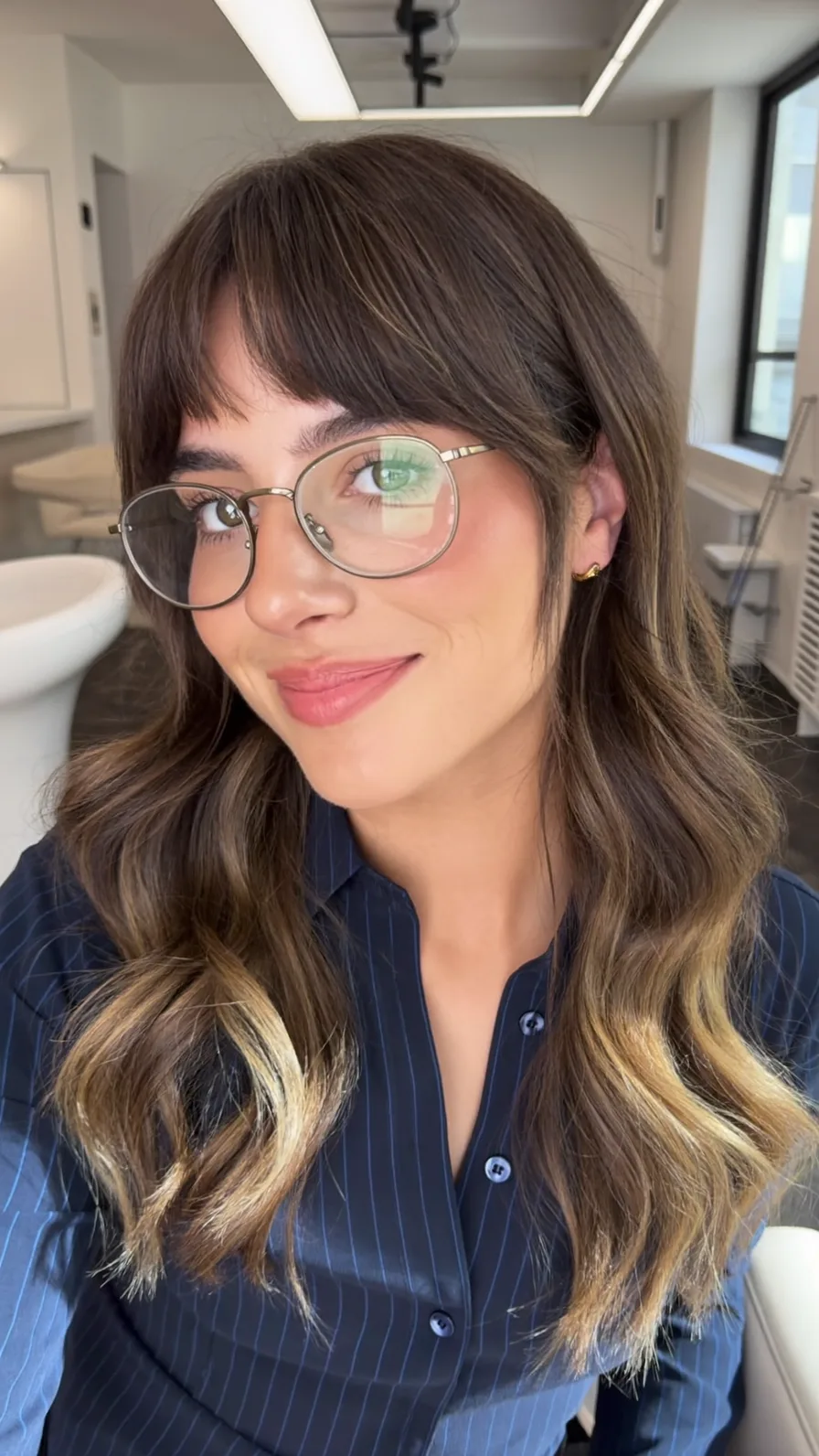 Medium Length Wavy Hair with Curtain Bangs and Balayage Highlights