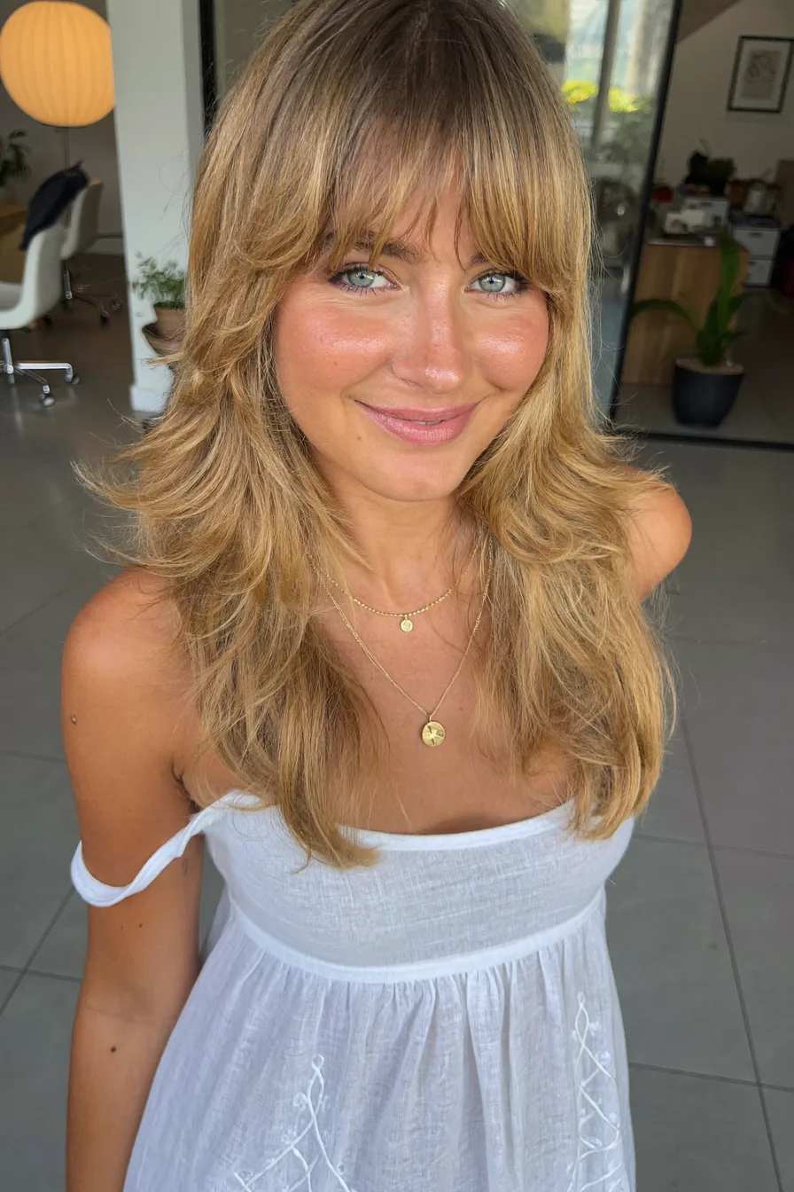 Modern Textured Shag with Warm Honey Blonde Curtain Bangs