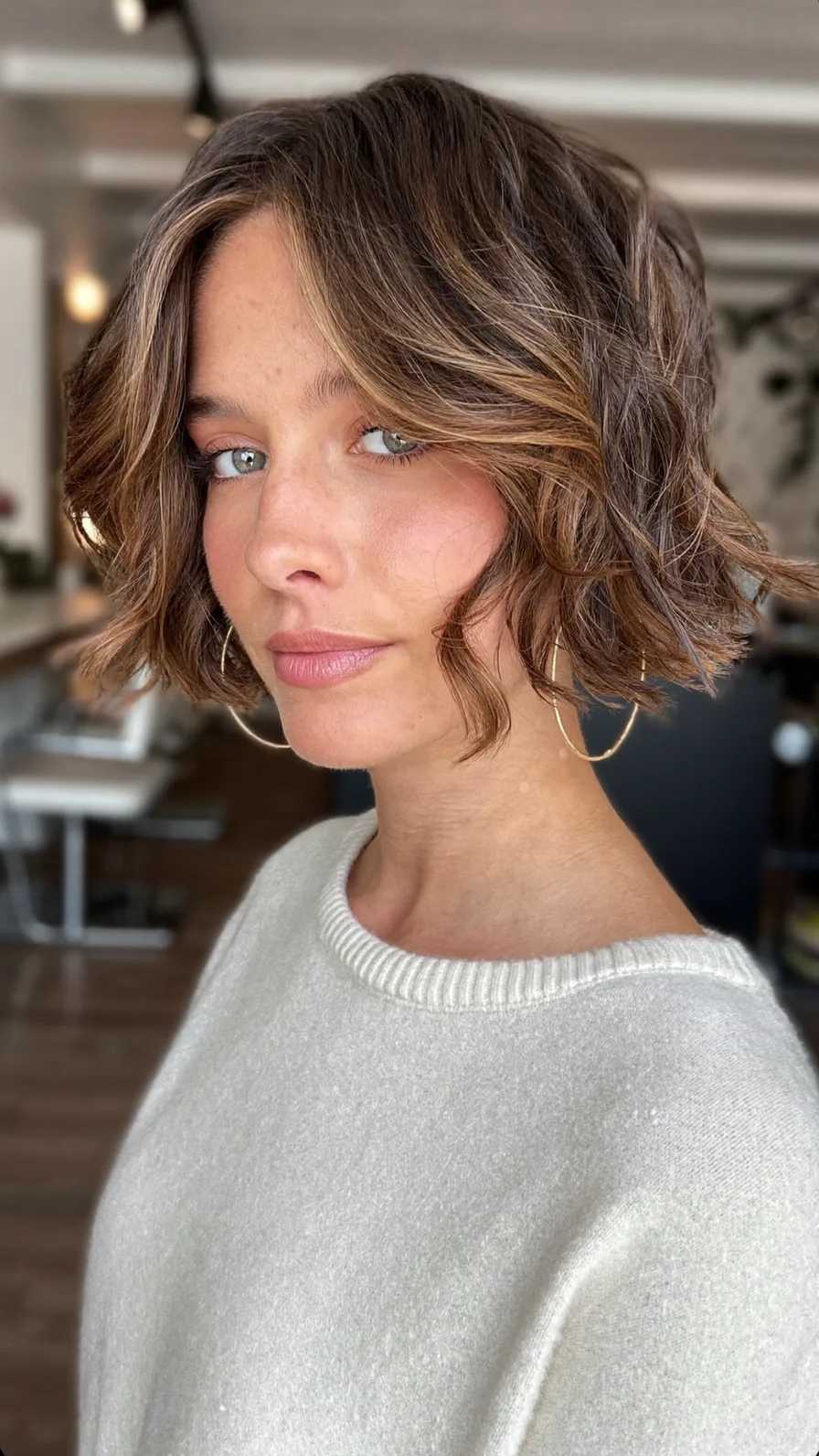 Textured Wavy Chin-Length Bob with Honey Blonde Balayage Highlights