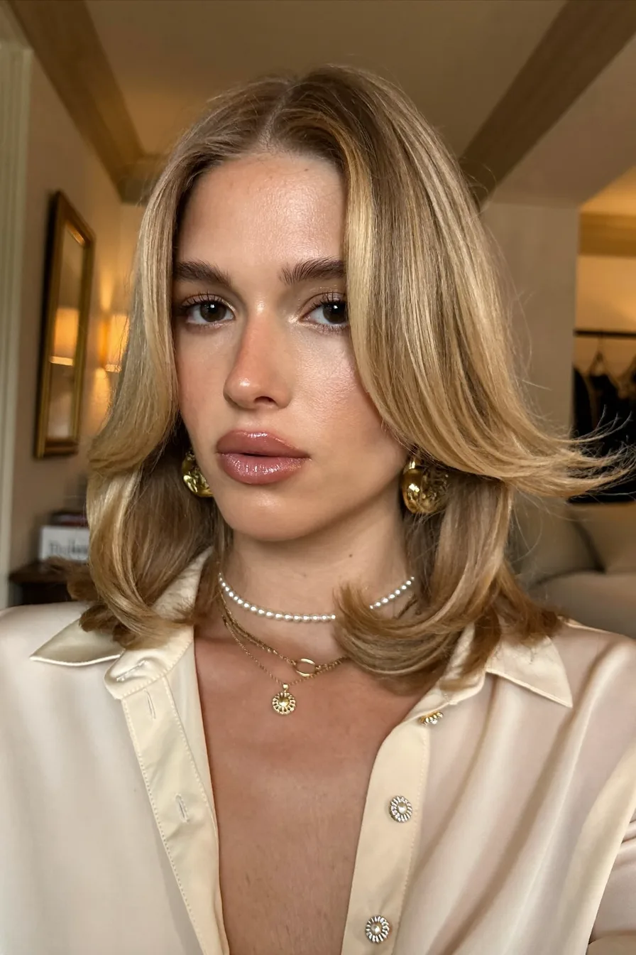 Classic Shoulder-Length Feathered Layers with Curtain Bangs