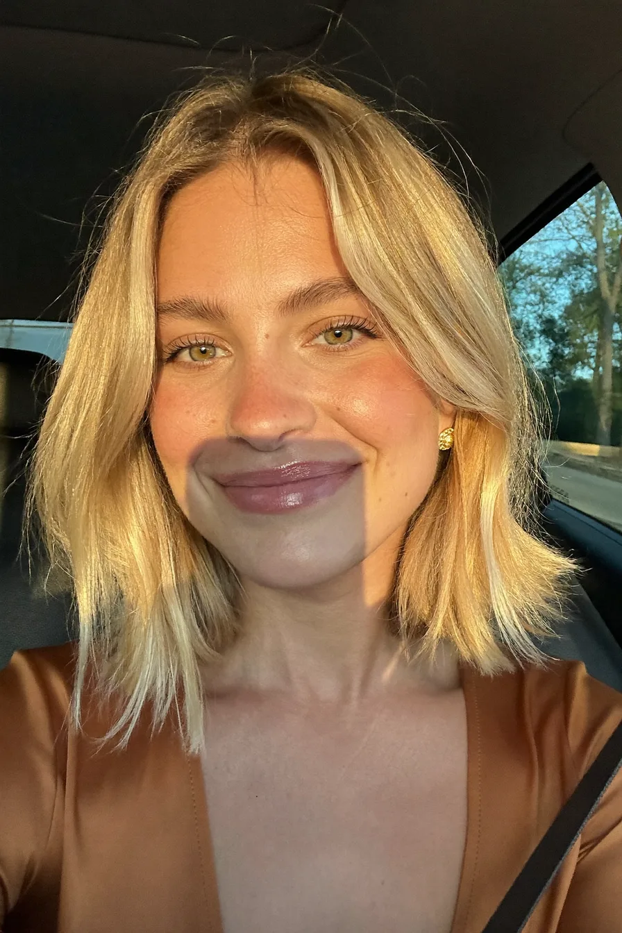 Warm Honey Blonde Shoulder-Length Lob With Curtain Bangs