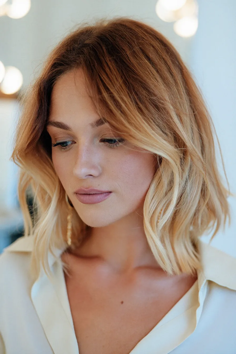Modern Shoulder-Length Lob with Honey Blonde Curtain Bangs