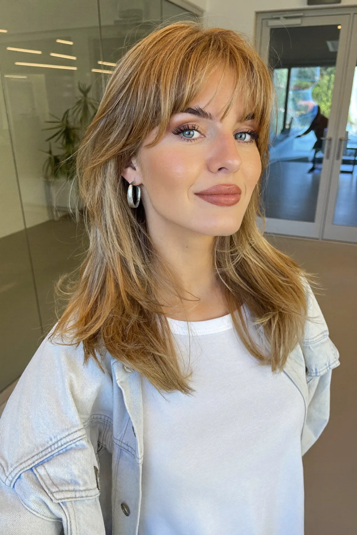 Sleek Honey Golden Blonde Lob with Curtain Bangs and Balayage