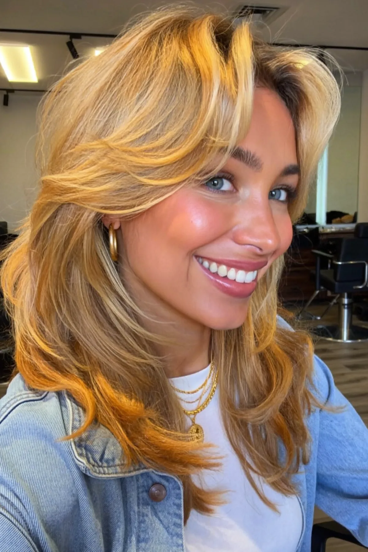 Honey Golden Blonde Wavy Lob with Blended Balayage and Curtain Bangs