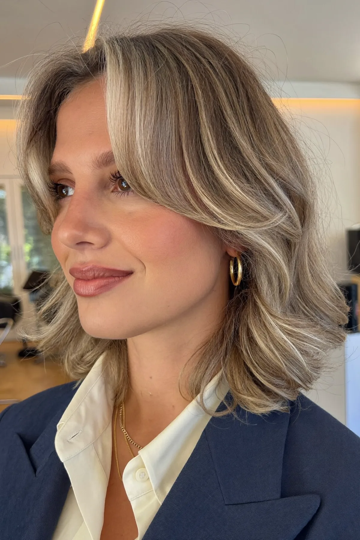Honey Golden Blonde Wavy Lob with Curtain Bangs and Balayage