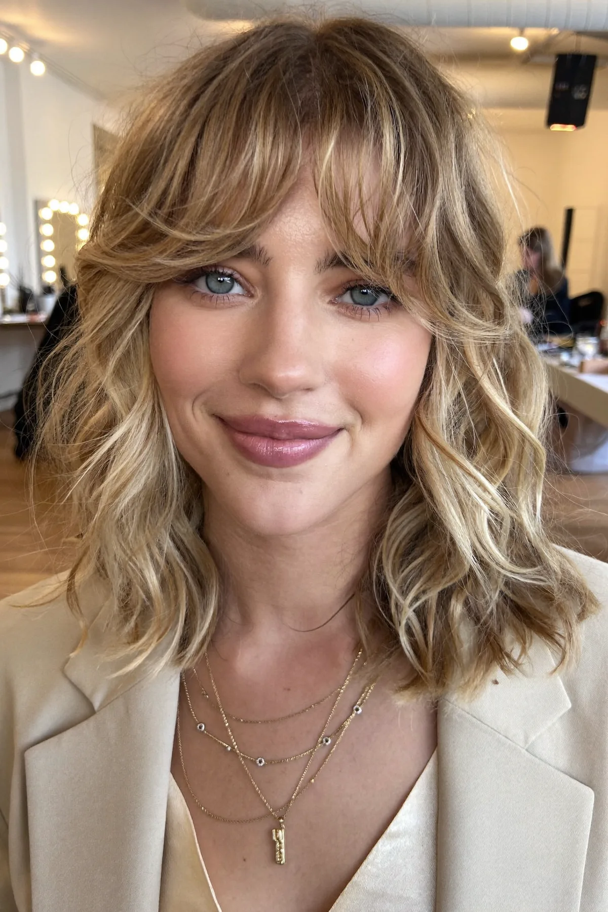 Honey Golden Blonde Wavy Lob with Curtain Bangs and Balayage