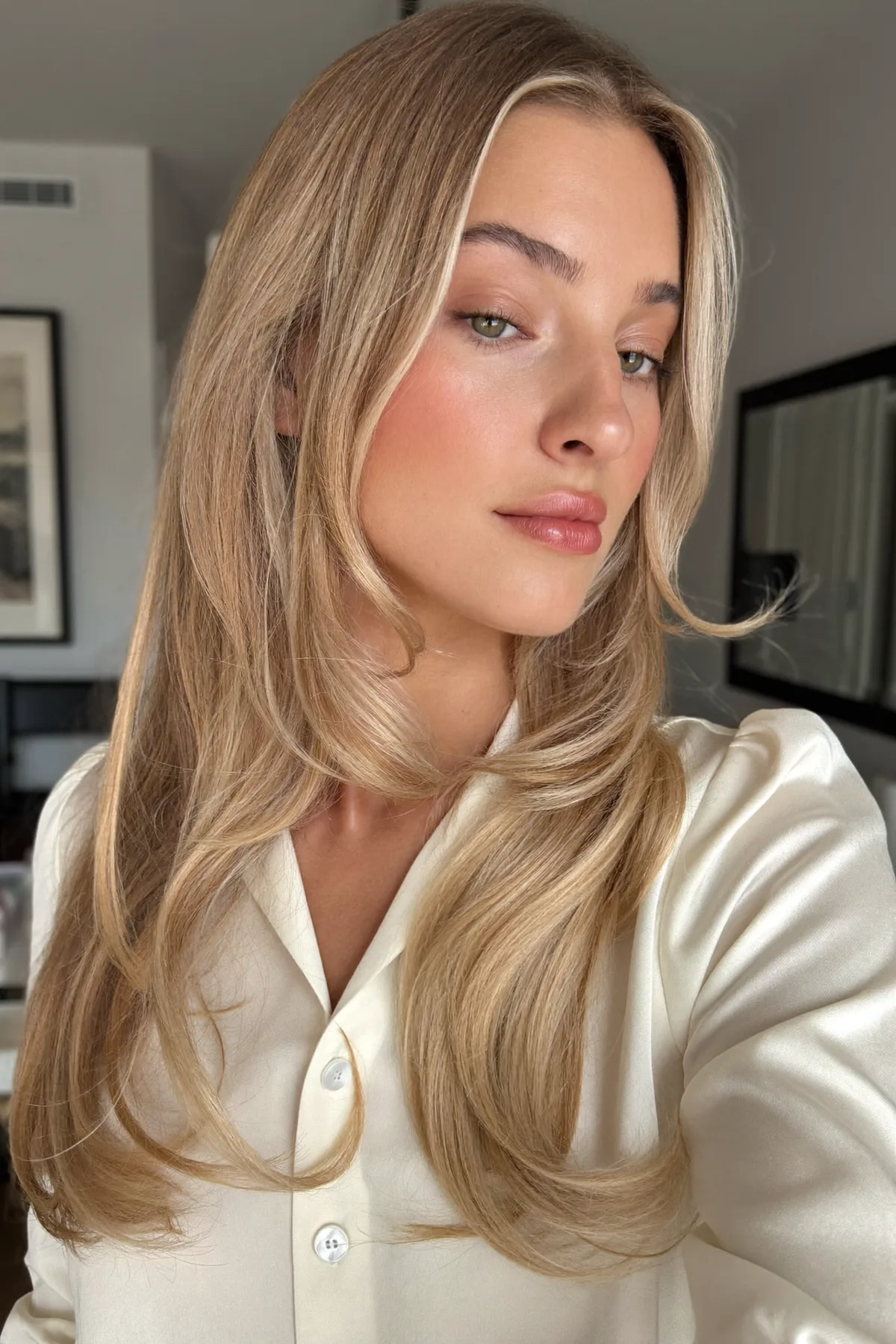 Sleek Honey Golden Blonde Long Layered Cut with Curtain Bangs