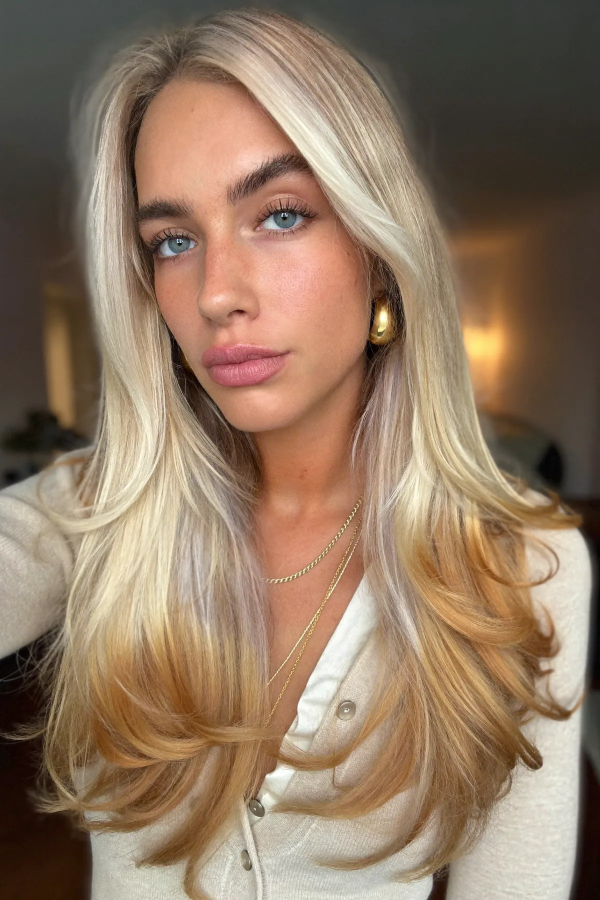 Honey Golden Blonde Long Layered Cut with Curtain Bangs and Money-Piece Melt