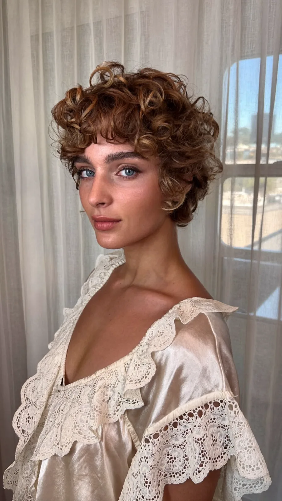 Voluminous Curly Pixie Cut with Textured Curtain Bangs