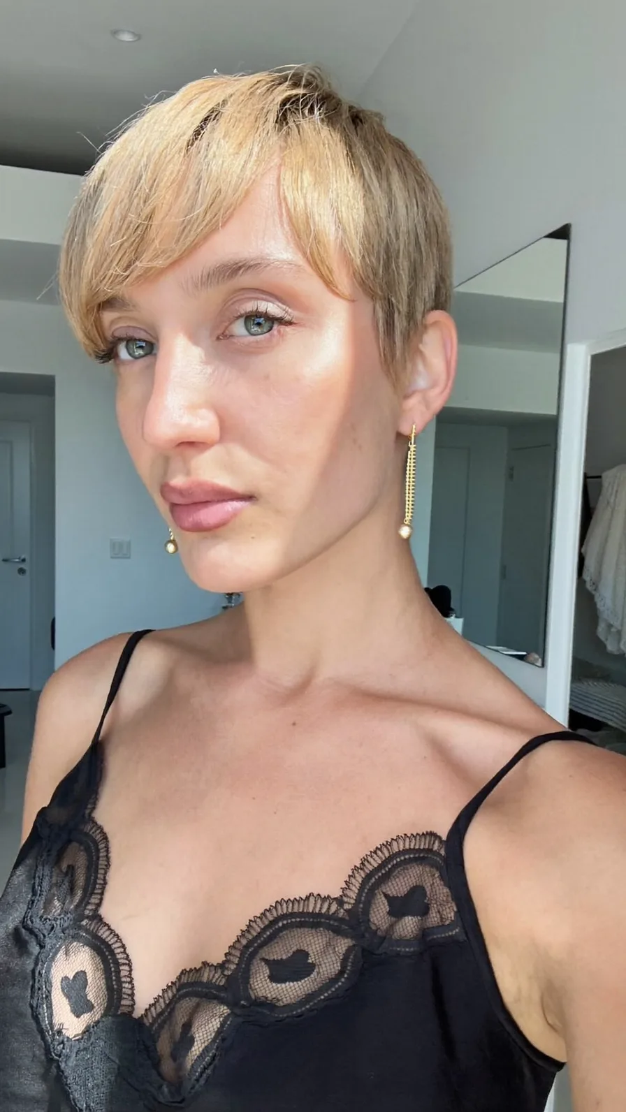 Sleek Warm Honey Blonde Pixie with Side-Swept Bangs