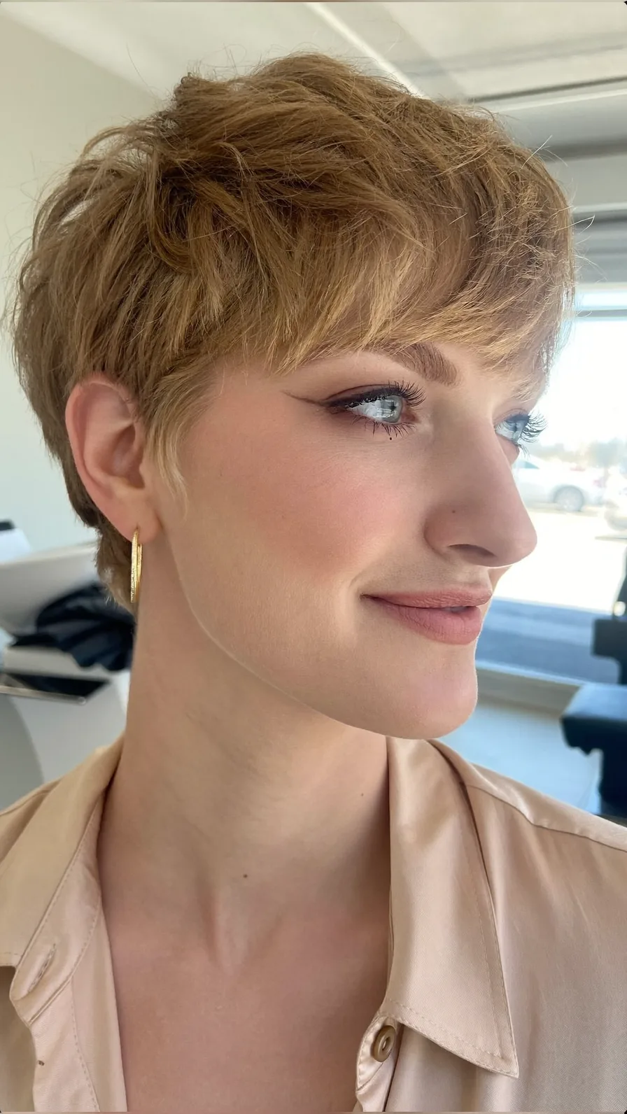 Textured Side-Swept Pixie Cut with Warm Honey Blonde