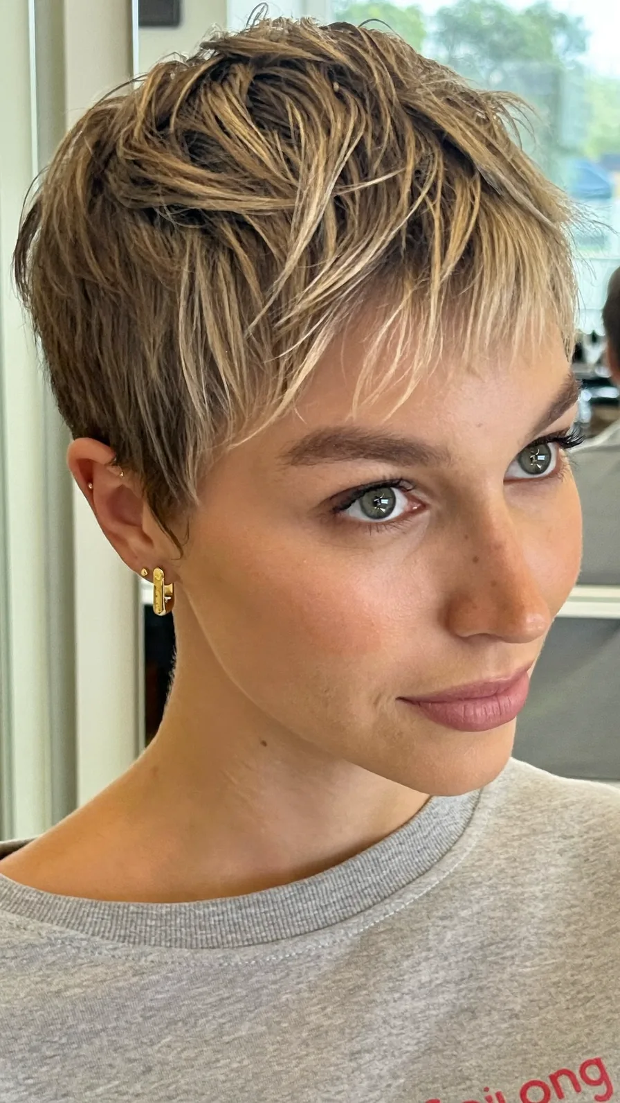 Textured Pixie Cut with Warm Honey Blonde Highlights