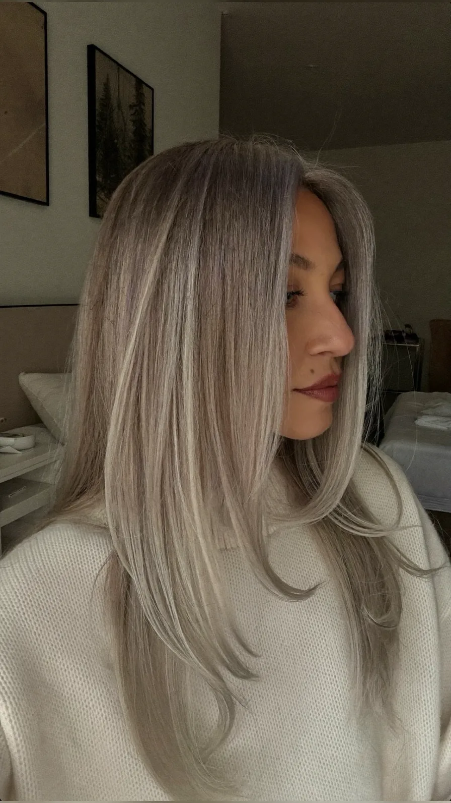 Flowing Long Layers with Icy Curtain Bangs for Elegance