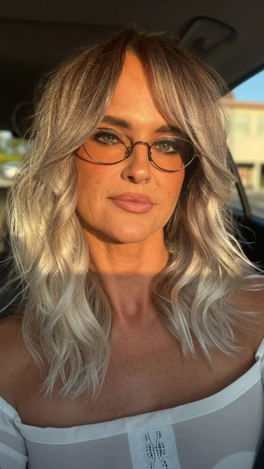 Icy Silver Blonde Medium Layers with Soft Curtain Bangs Style