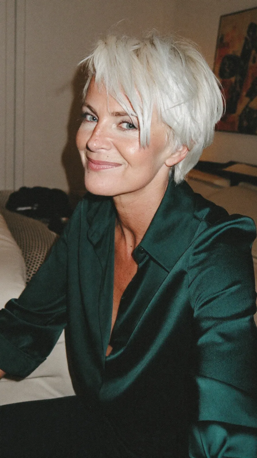 Textured Platinum Blonde Pixie Cut with Side-Swept Bangs