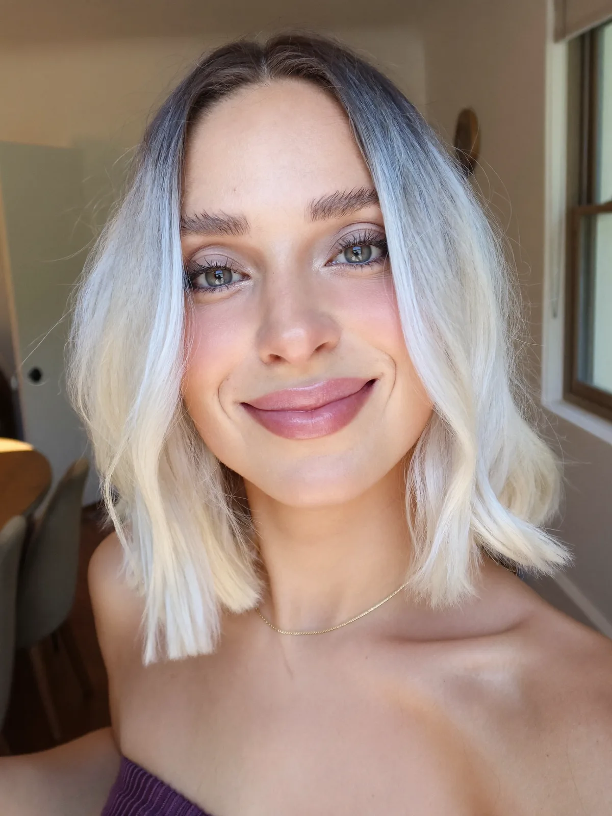 Textured Icy Blunt Bob with Subtle Wave and Dark Roots