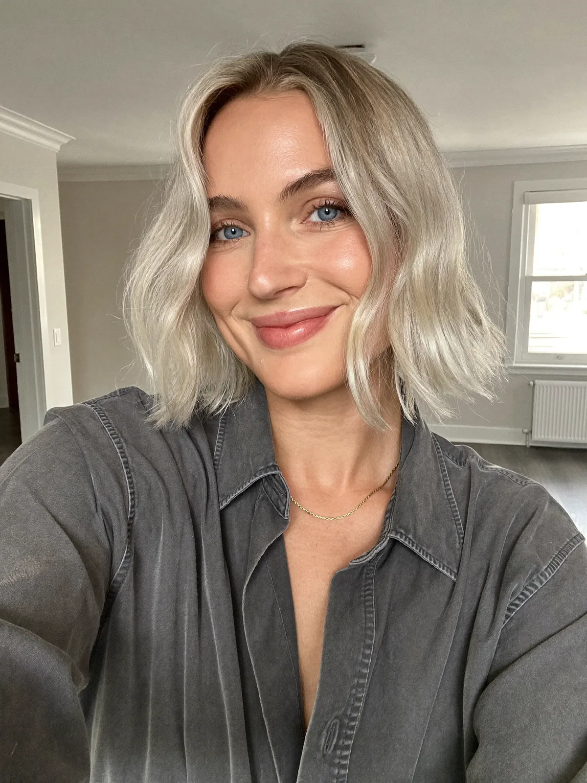 Icy Blunt Bob with Soft Waves and Subtle Root Shadow Detail