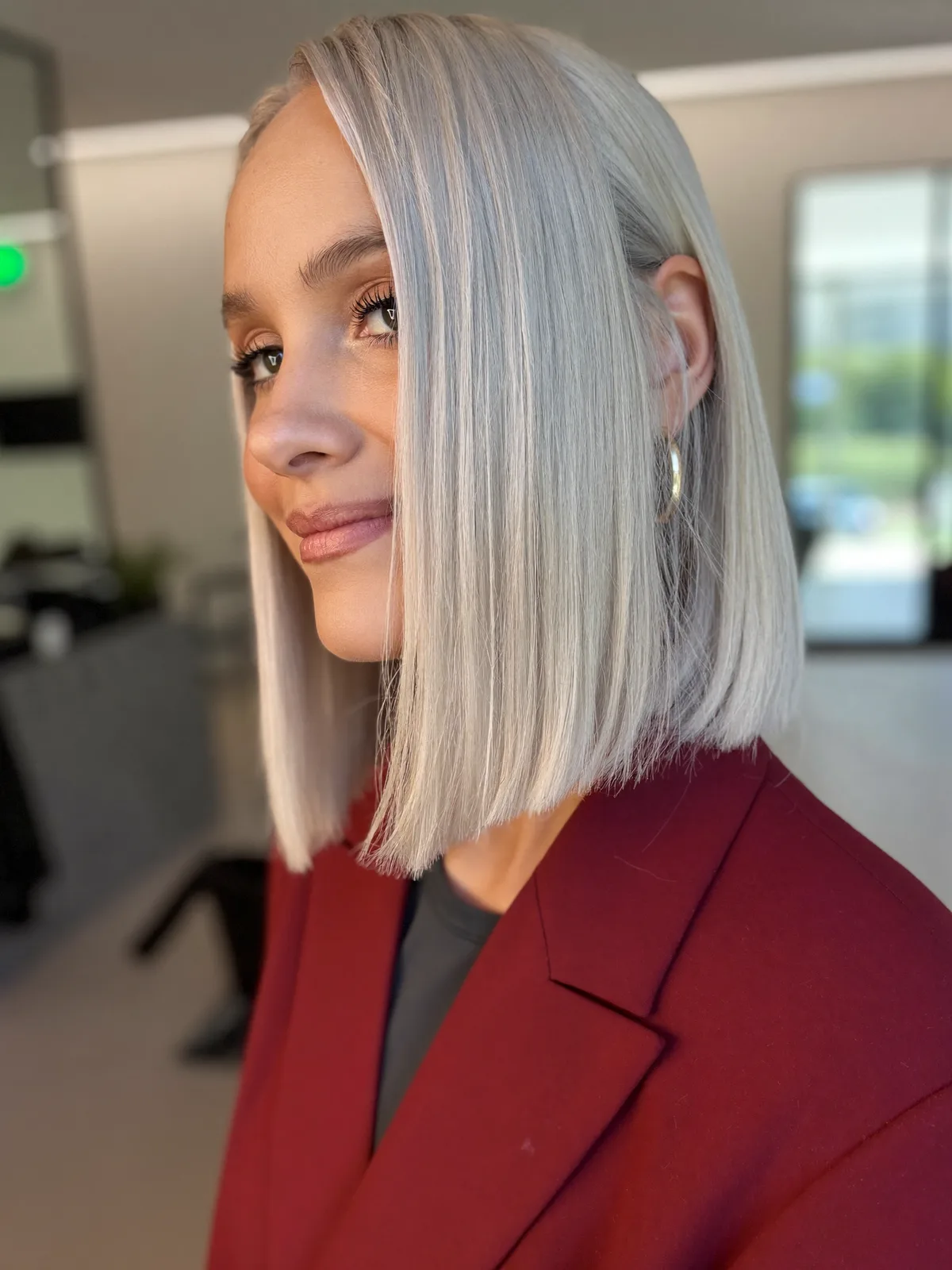Sleek Platinum Inverted Bob With Dramatic Side Part Styling