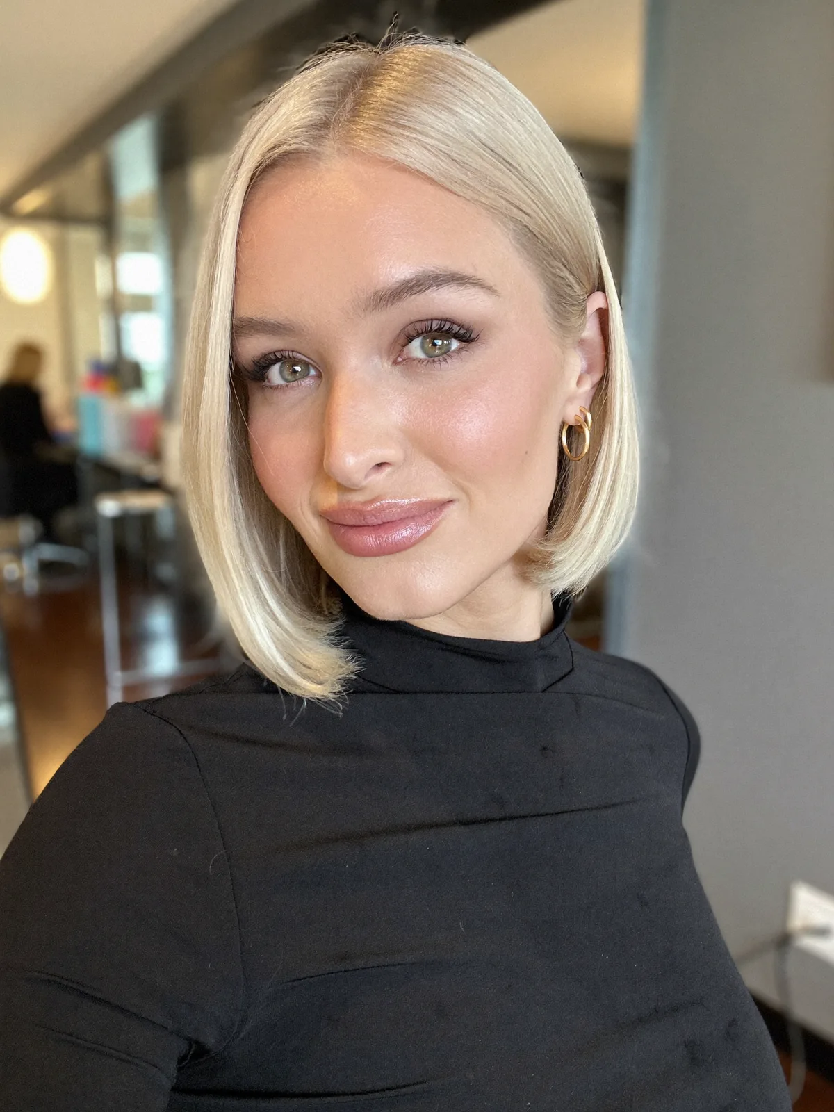 Sleek Center-Parted Inverted Bob with Polished Blonde Finish