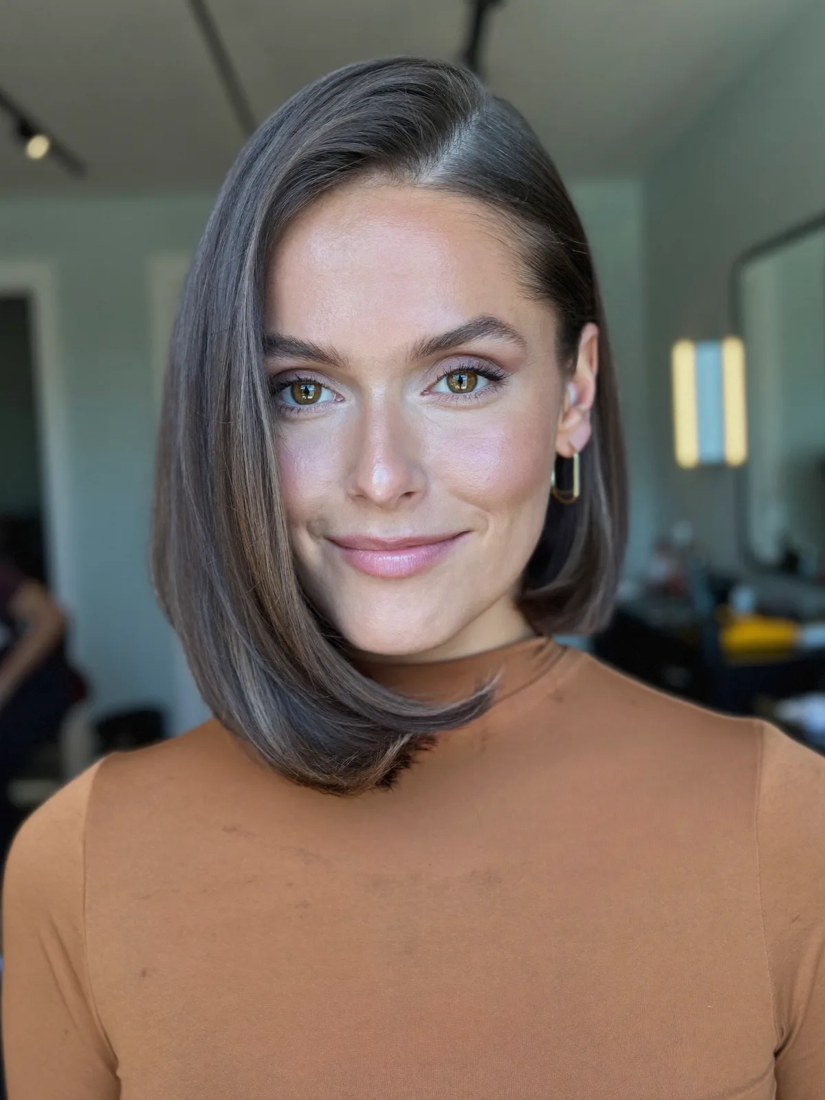 Sleek Inverted Bob with Deep Side Part and Smooth Finish