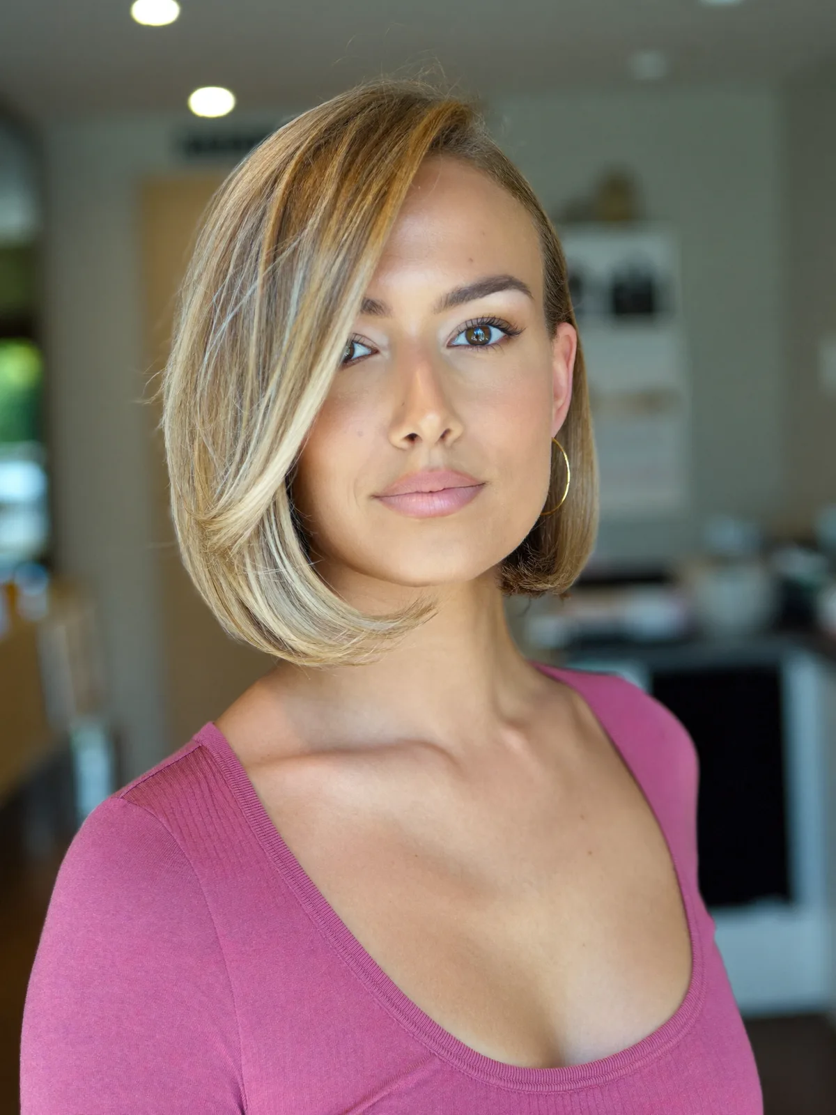 Sleek Inverted Bob with Deep Side Part and Subtle Balayage Highlights