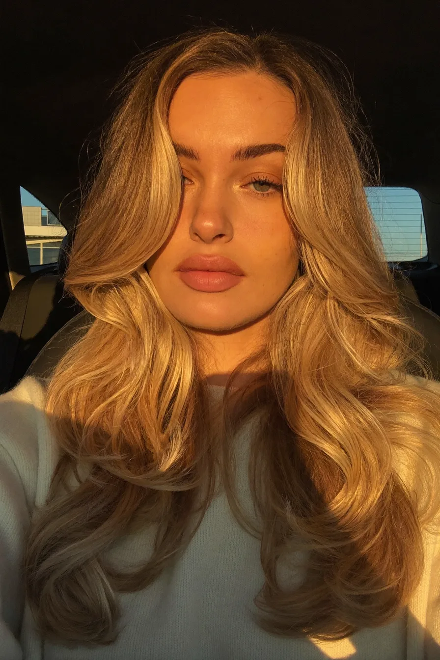 Sun-Kissed Golden Blonde Long Layered Cut with Flowing Volume