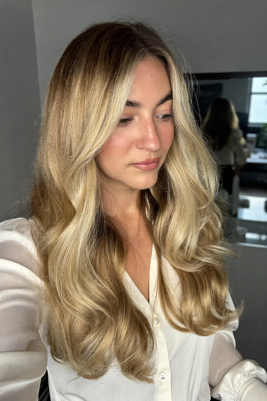 Glossy Golden Blonde Long Layered Hair with Face-Framing Waves