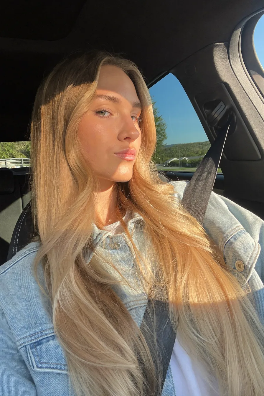 Natural Sun-Kissed Golden Blonde Long Layered Haircut with Soft Flow