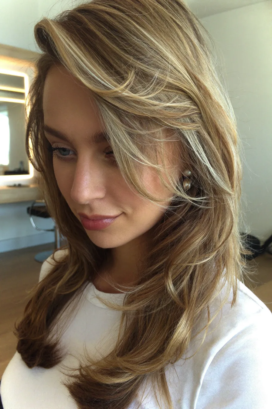 Softly Textured Golden Blonde Long Layered Hair with Face-Framing Pieces