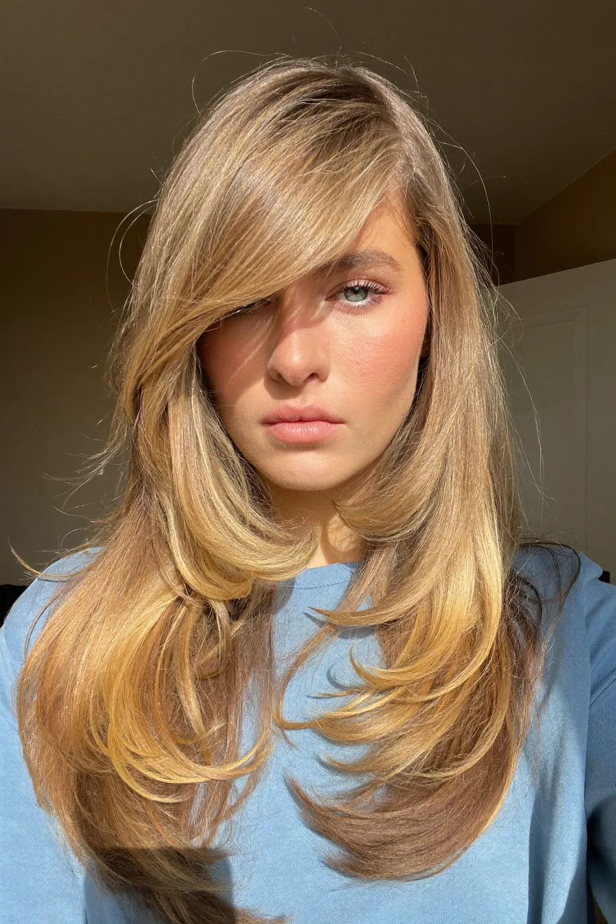 Sun-Kissed Golden Blonde Long Layered Cut with Feathered Ends