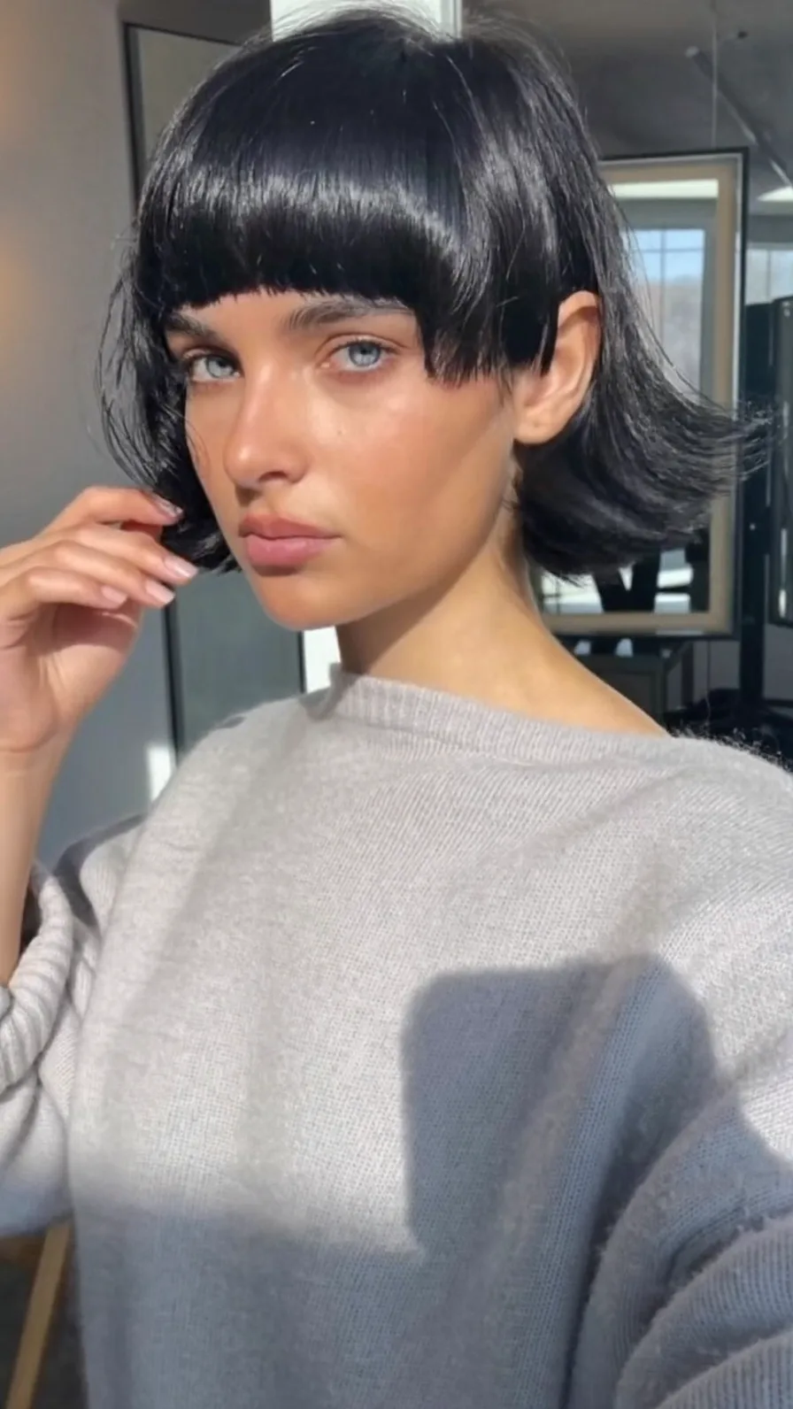 Chic Jet Black Blunt Bob with Flicked Ends and Bangs