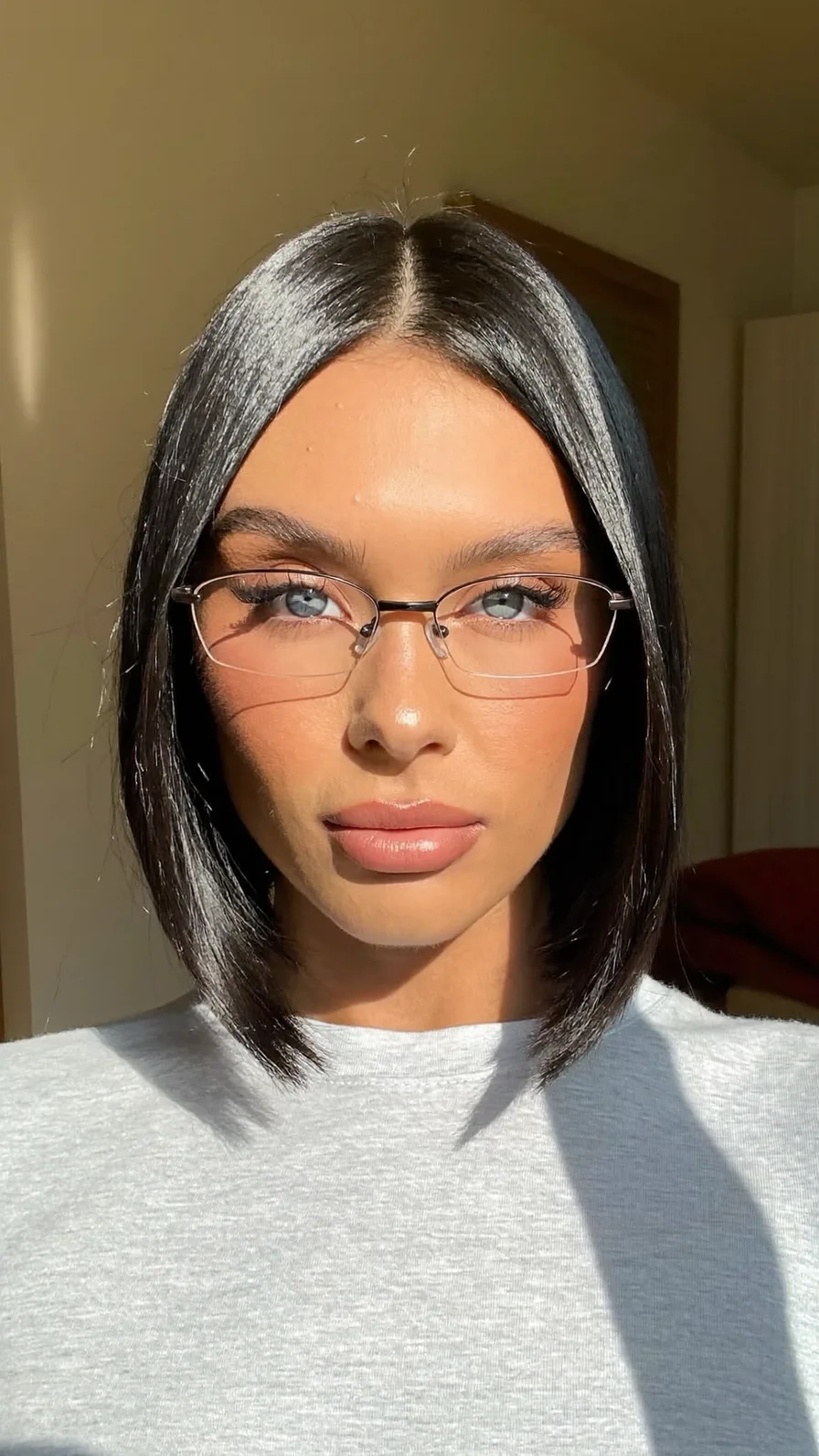 Sleek Chin-Length Classic Blunt Cut Bob with Center Part