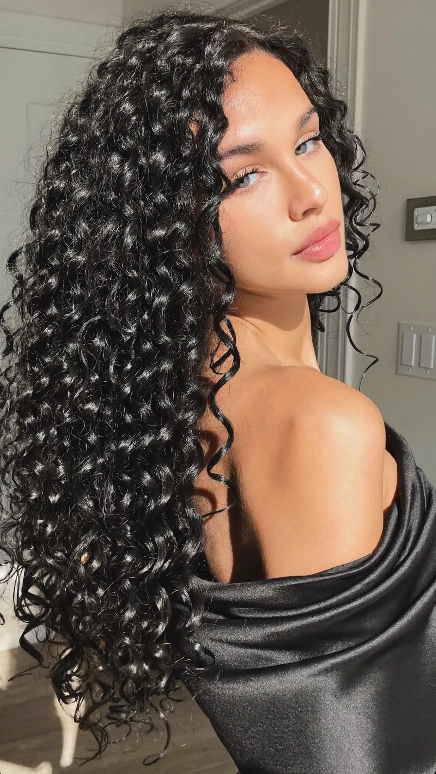 Voluminous Long Layers with Defined Curly Texture and Center Part